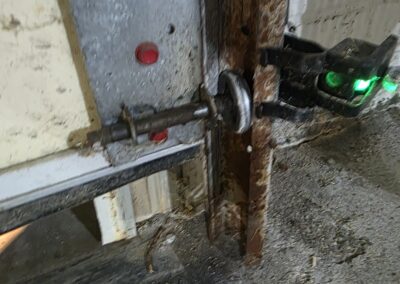 An off track door caused by rust. Roller out came out after the rusty cable snapped.