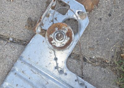 Removed parts from garage door track and extension spring system due to extreme rust.